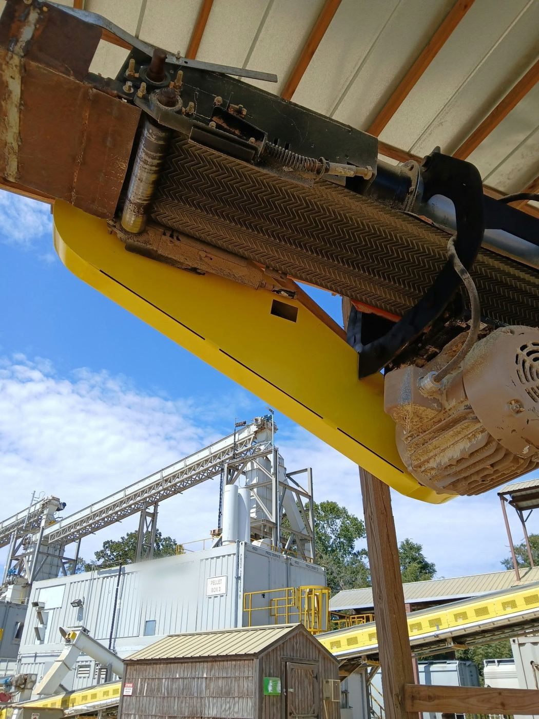 Underside view of the installed guard and relocated motor.