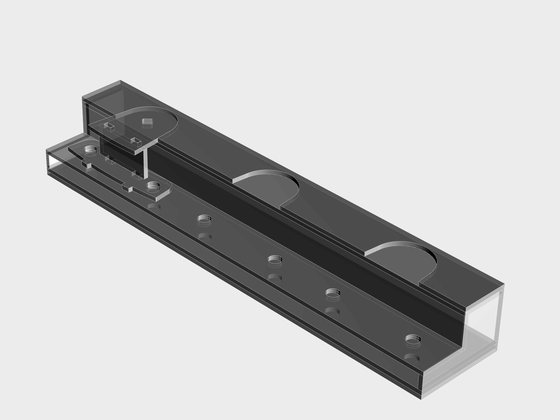 Model of a welding fixture rail with locating pads and bolt holes for three bearing brackets.