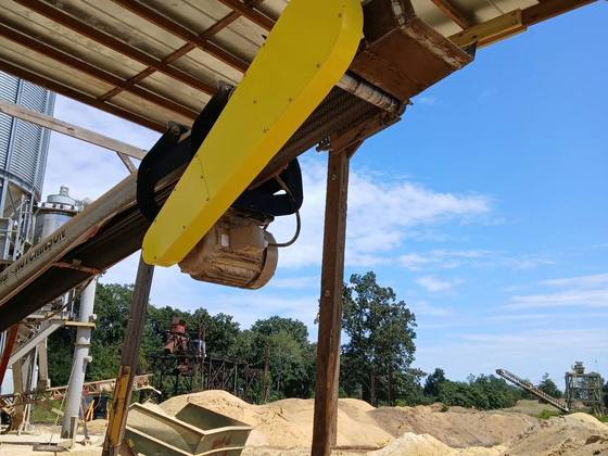 Belt guard on the relocated conveyor drive.