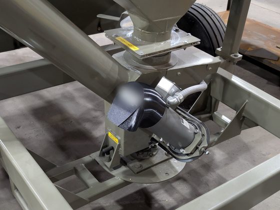 The printed snorkel installed on the motor of a painted feeder machine.