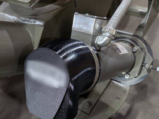 Close view of a black printed snorkel clamped to a motor intake.
